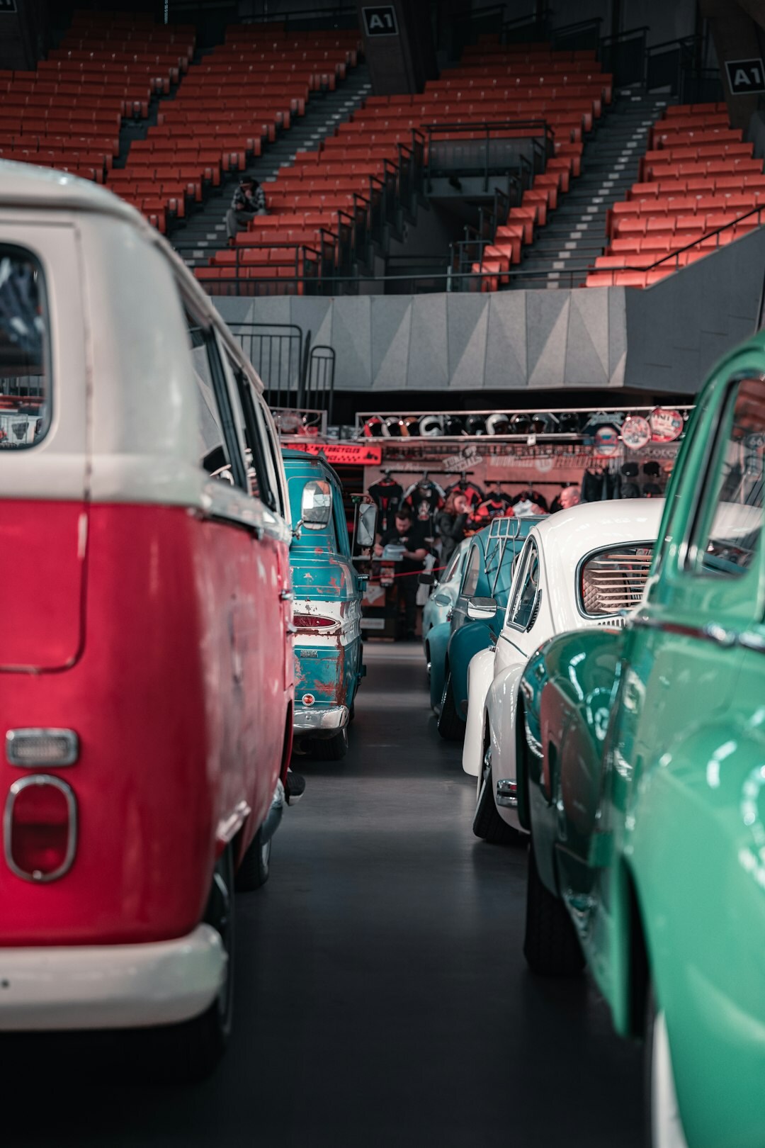Interior of a classic car museum with rows of vintage automobiles