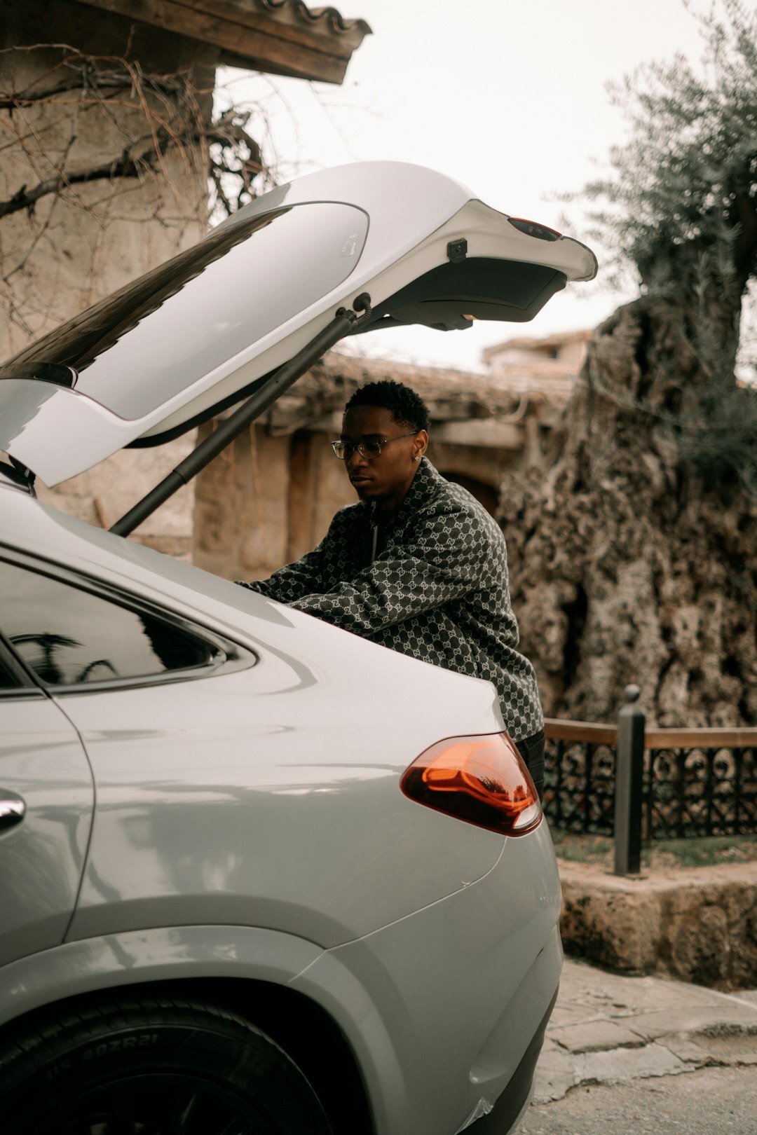 mechanic working on luxury car